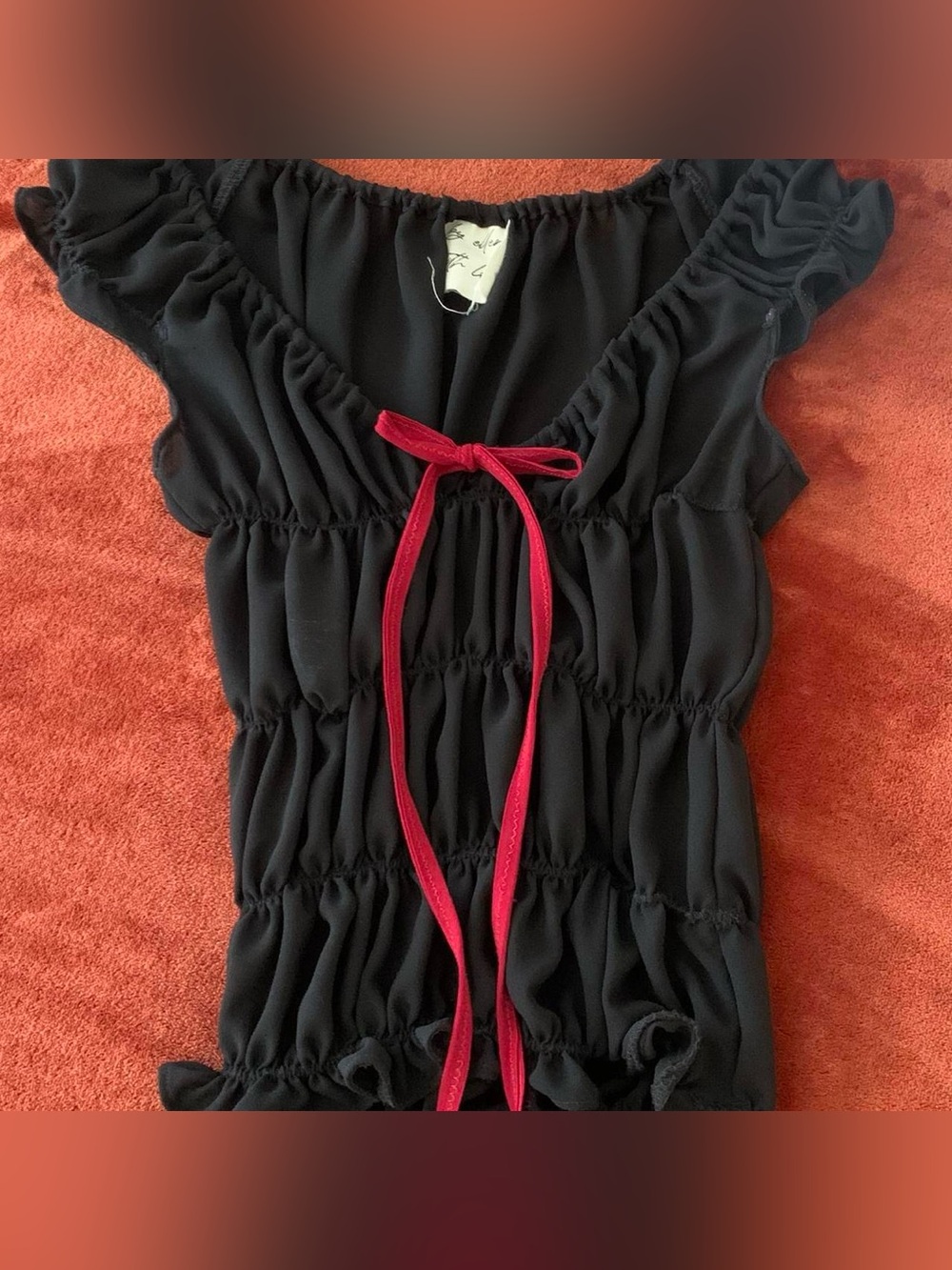 Black ruffle top from By Ellen With Love